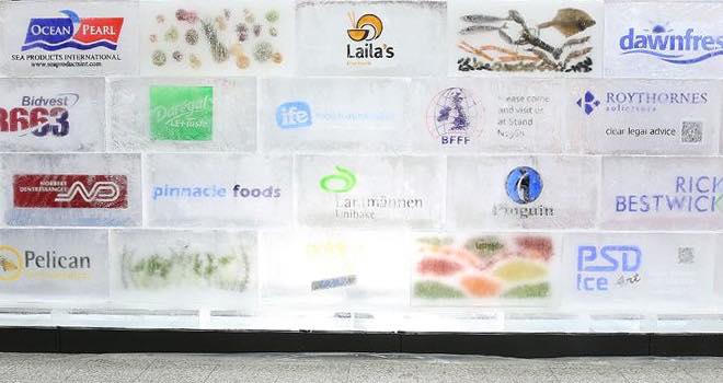 Frozen food federation builds huge ice wall to highlight food waste problem