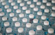 Bottled water contains hundreds of thousands of invisible microplastic particles, study finds